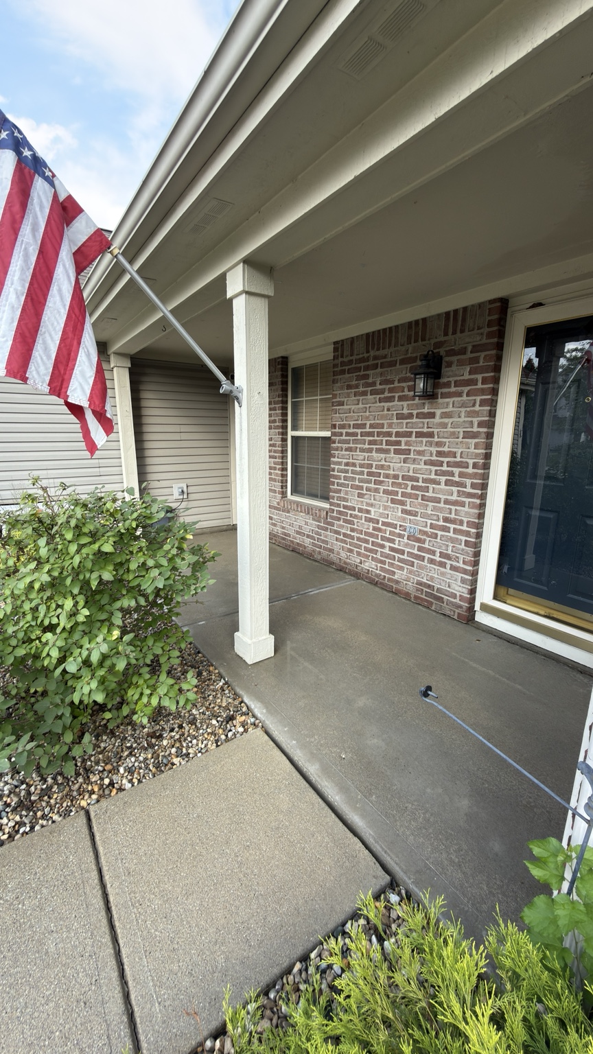 Covered front porch concrete after pressure washing