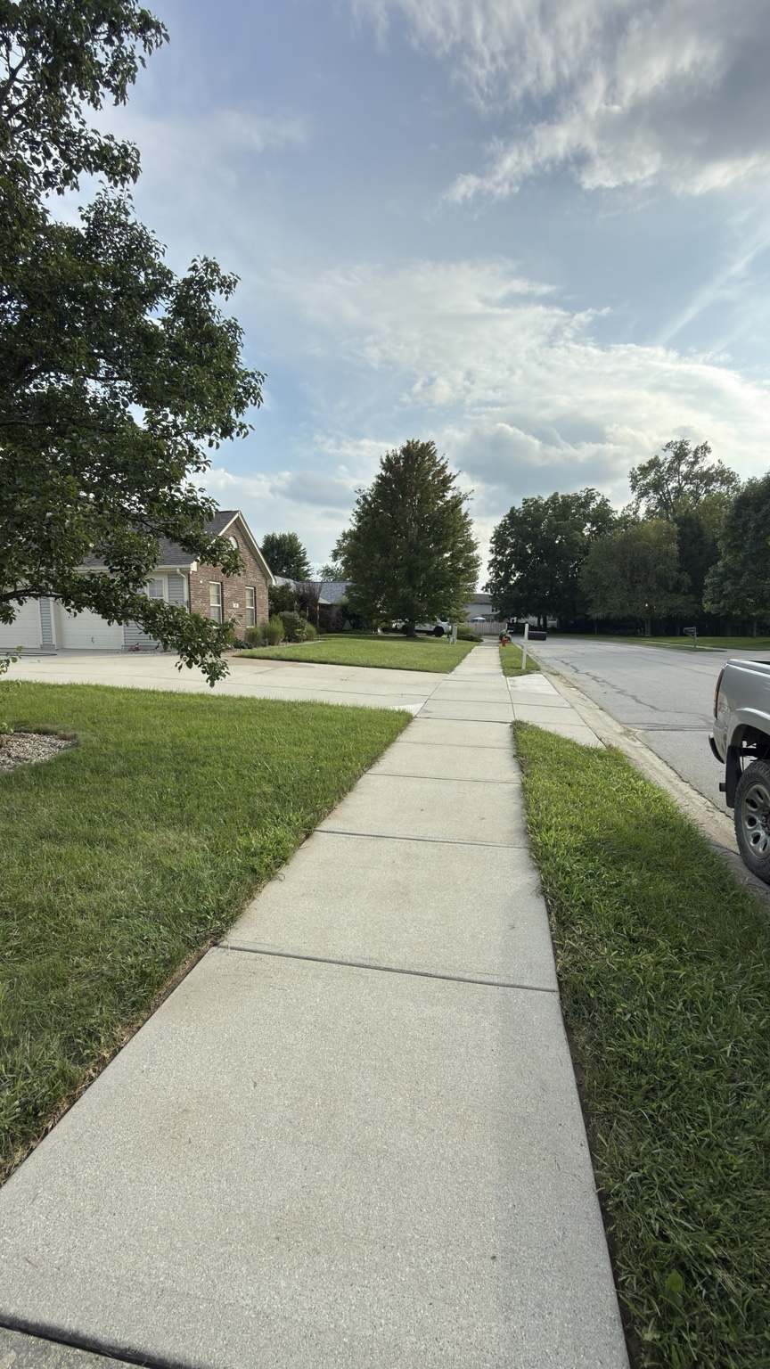 Street-side sidewalk after pressure washing