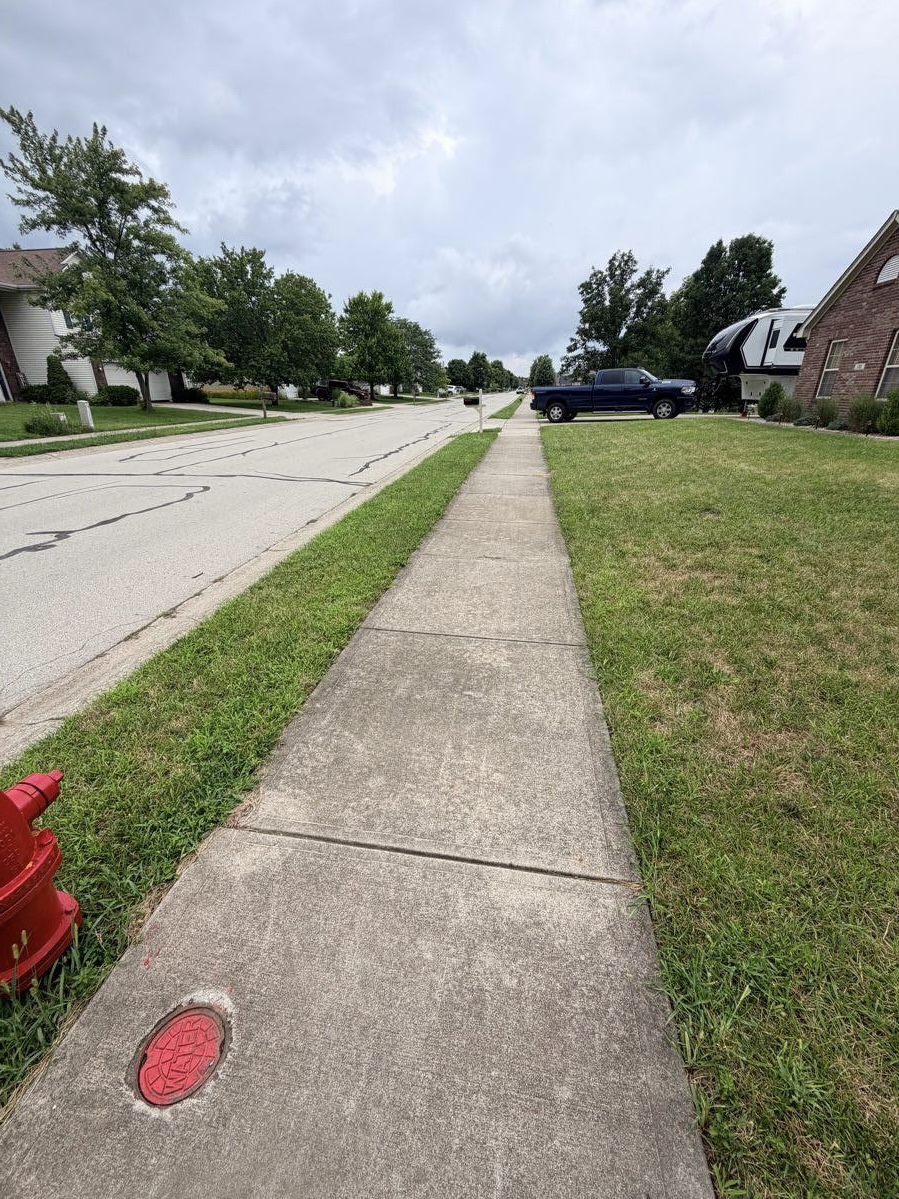 Street-side sidewalk before pressure washing
